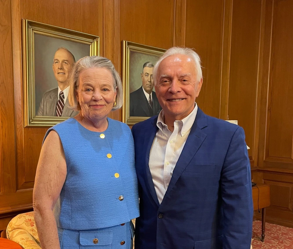 Rob and Jean Estes standing together both smiling