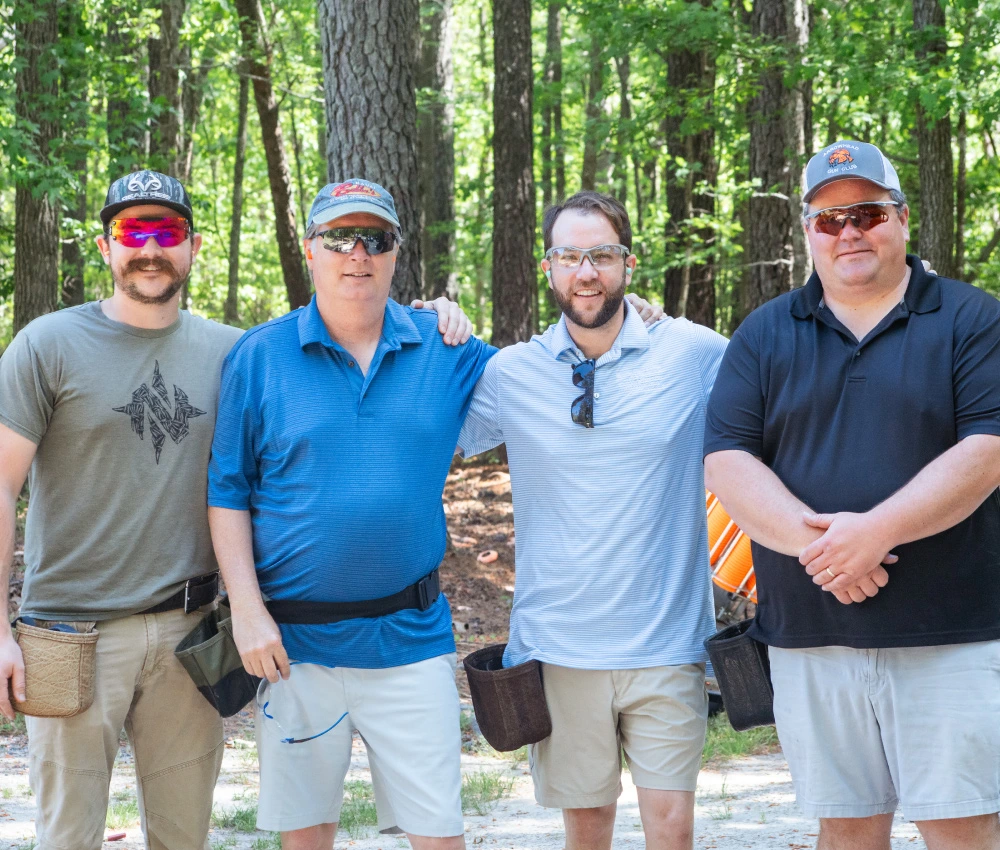 sporting clays classic team gathered for a team photo