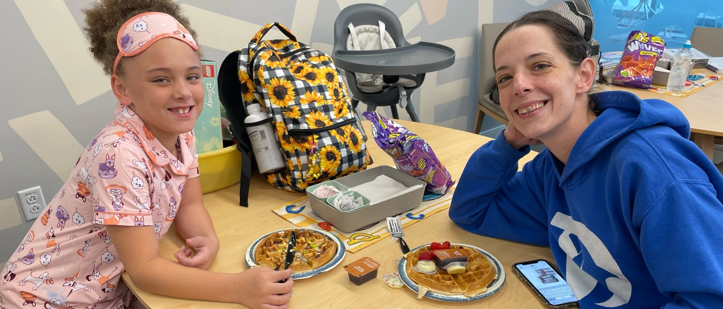 mother and child sitting together having breakfast