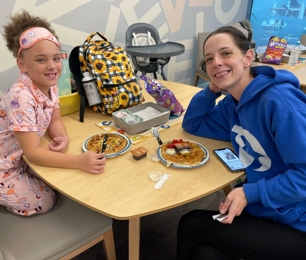 mother and child sitting together having breakfast