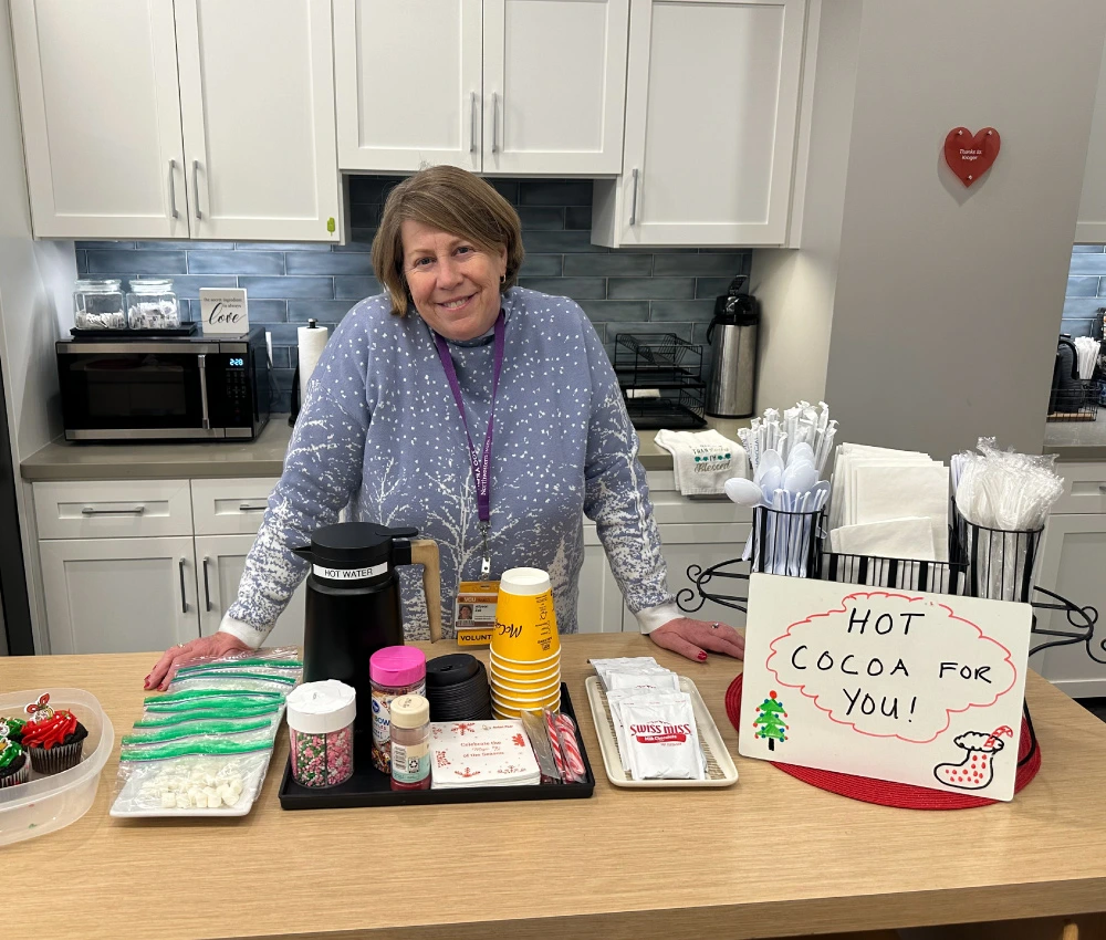 Ronald McDonald House of Richmond volunteer offering a hot cocoa bar to our guests