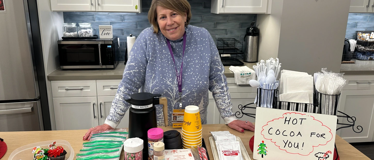 Ronald McDonald House of Richmond volunteer offering a hot cocoa bar to our guests
