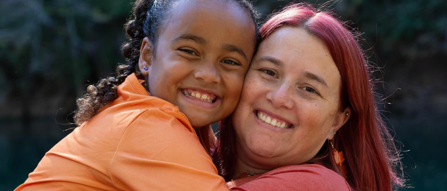mother and daughter embracing closely