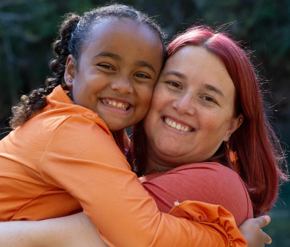 mother and daughter embracing closely